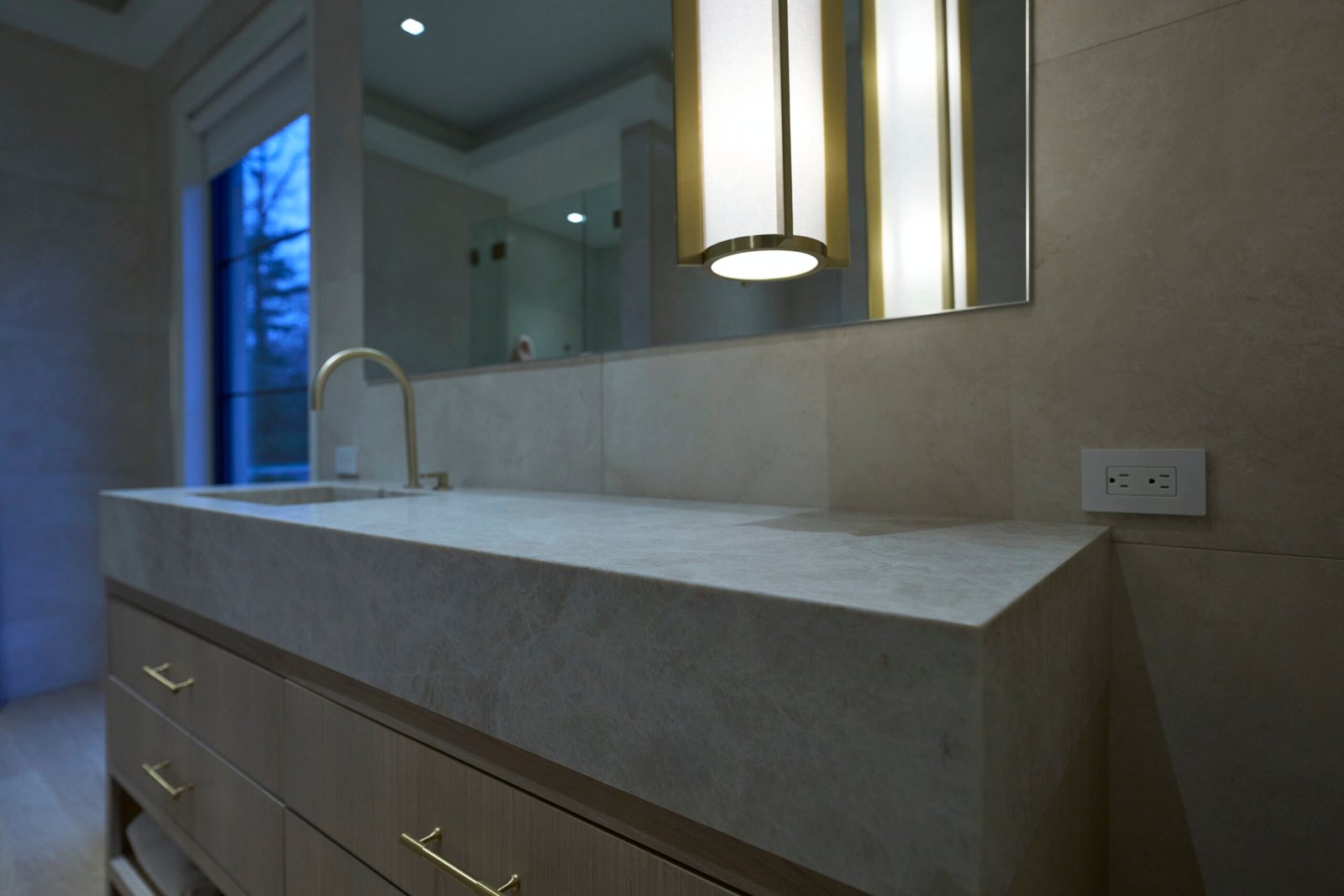 Bathroom quartzite countertop integrated sink wood vanity brushed gold hardware