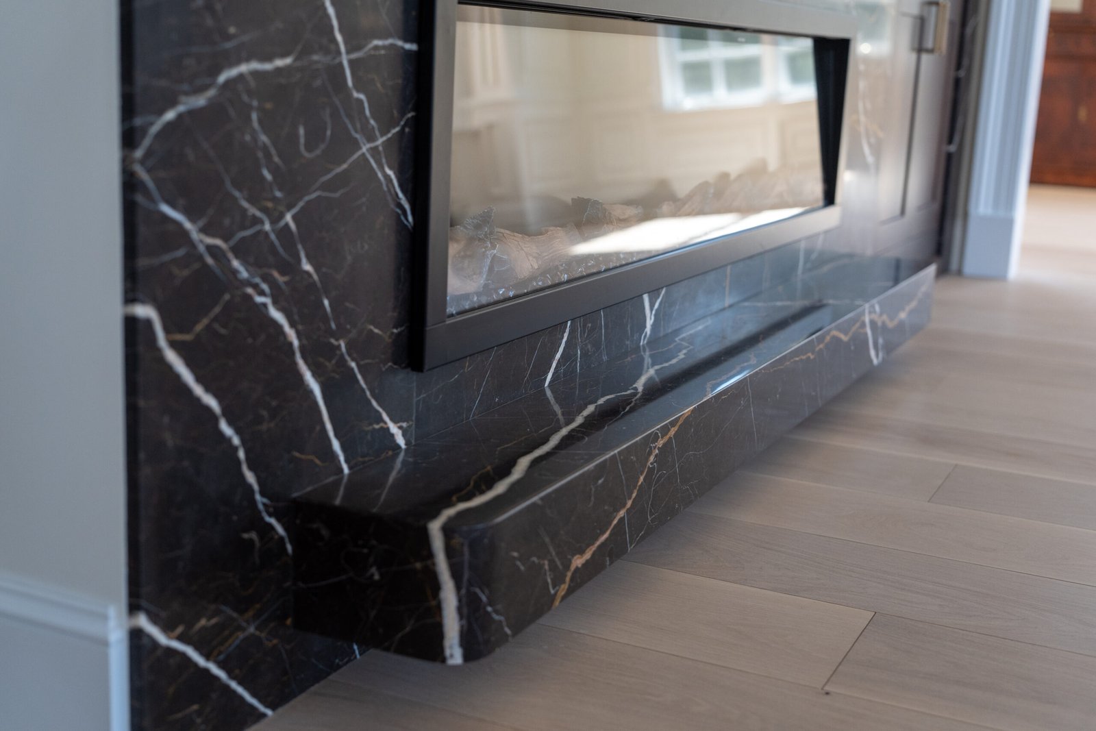 Black marble fireplace surround hearth detail
