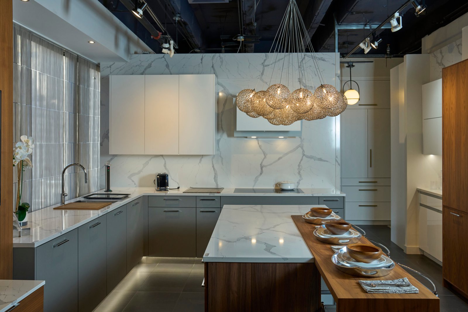 Quartz countertop full slab backsplash gray cabinetry