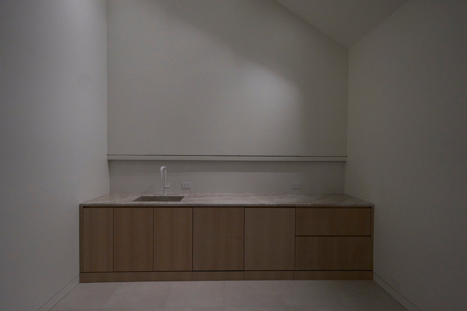 Laundry room quartzite countertop wood cabinetry