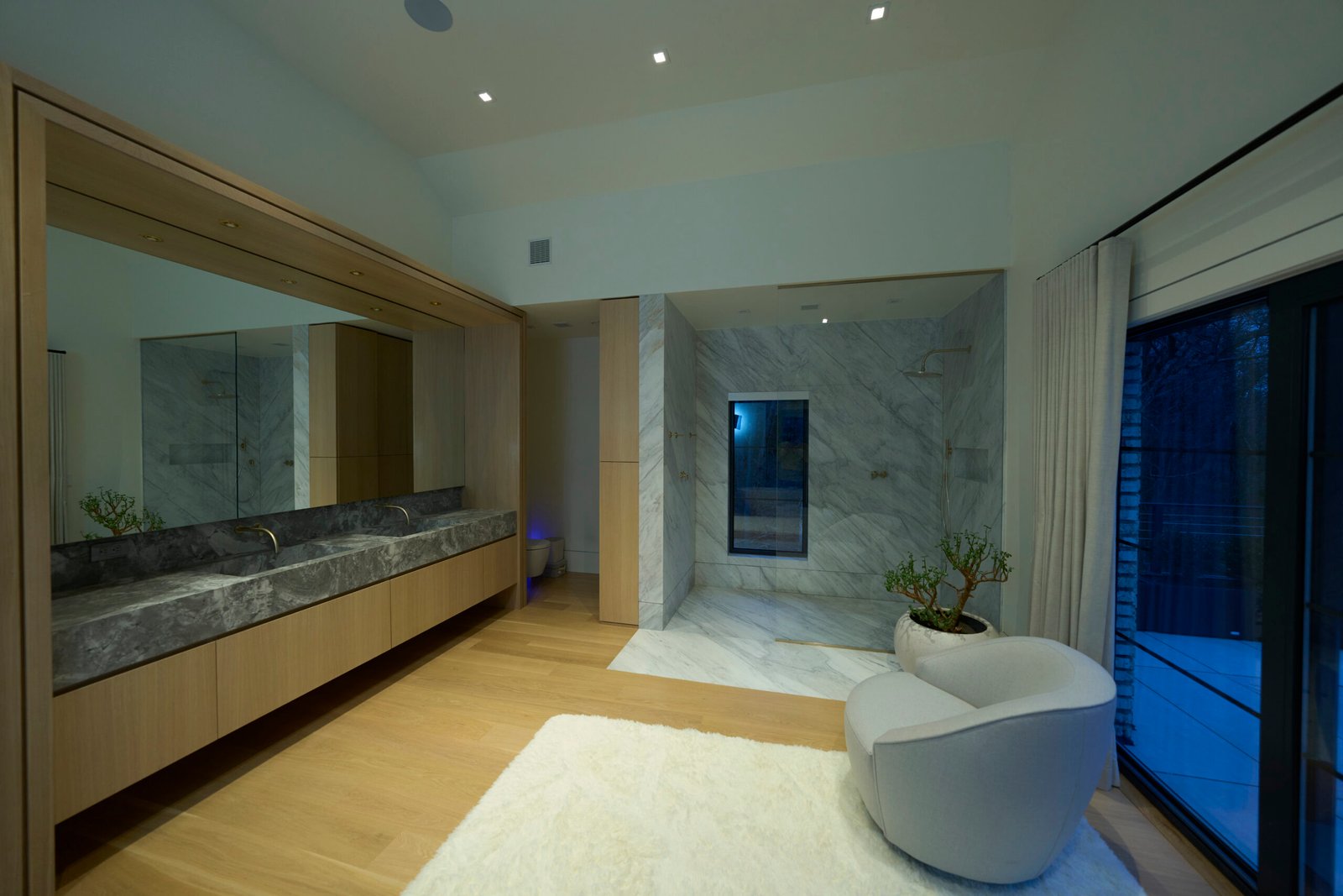 Natural stone master bathroom double vanity countertop shower walls floor