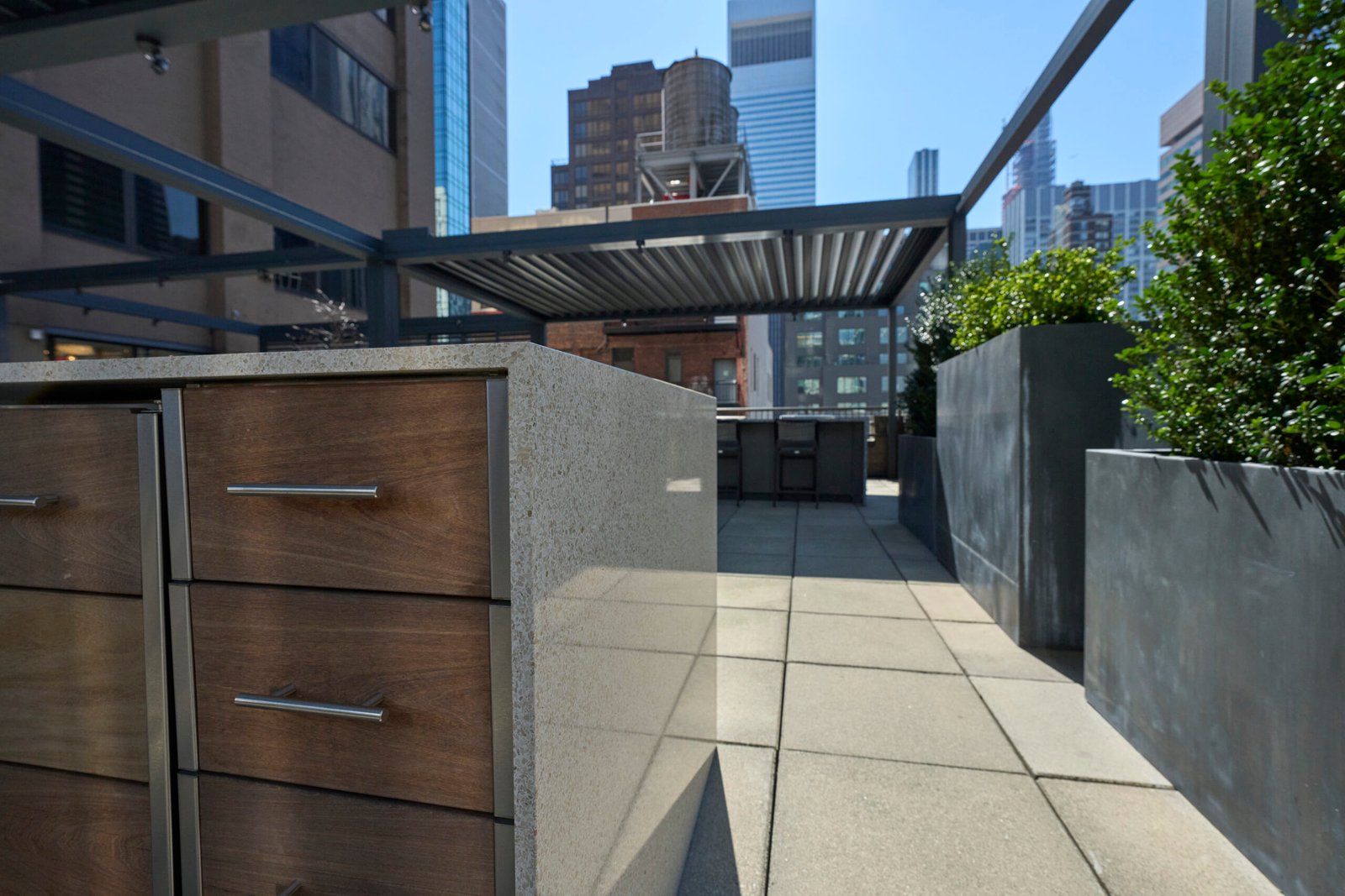 Rooftop outdoor kitchen terrazzo island city view