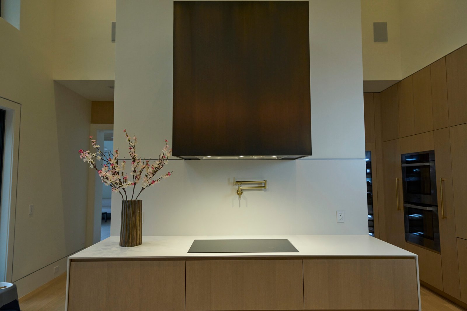 White porcelain kitchen island countertop cooktop cutout