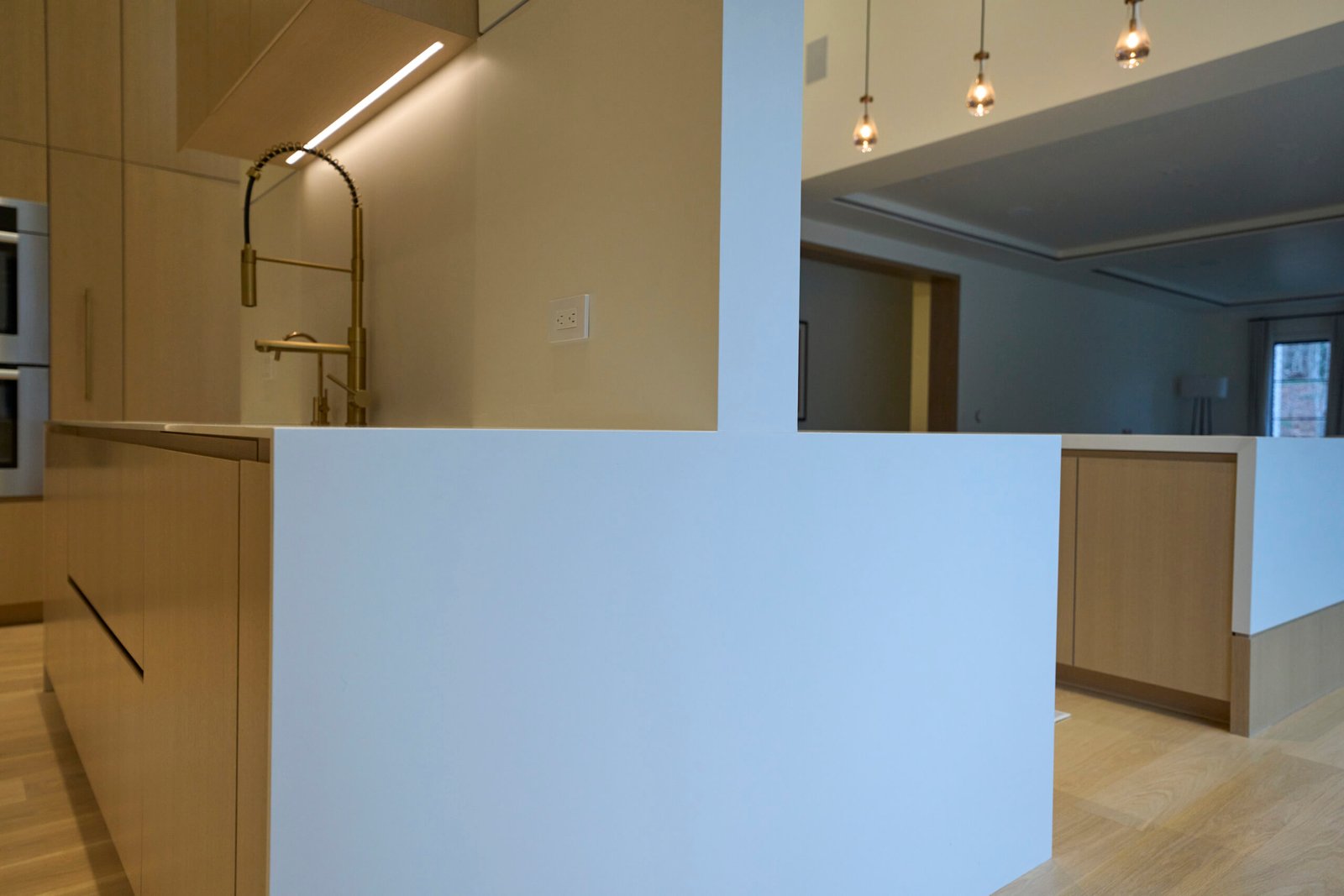 White porcelain kitchen island waterfall edge